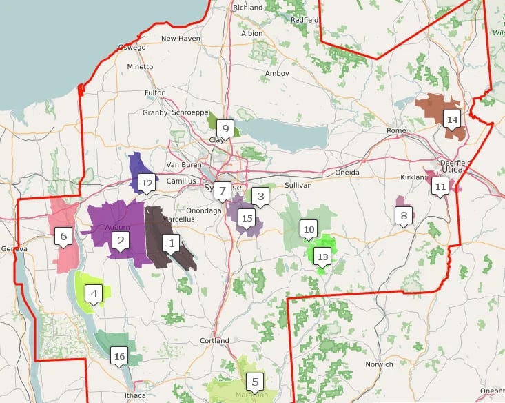 Colored map of a region showing district boundaries with numbered zones and green vegetation areas marked